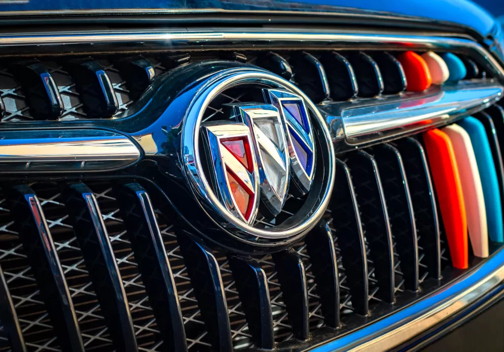 Close-up of a Buick logo on a car grille, representing Buick mechanics at Real Pro Auto.