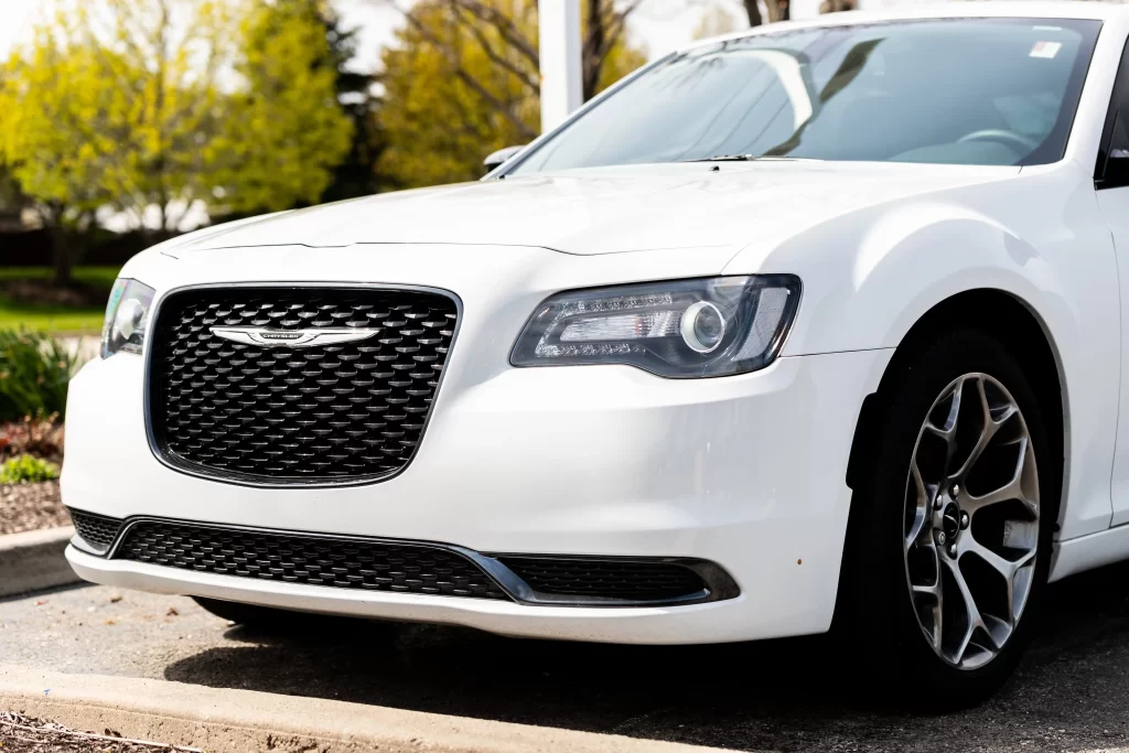 White Chrysler sedan parked outdoors, representing Chrysler mechanics at Real Pro Auto.